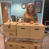 Board Member, Janice Pack, helped distribute boxes to clients on August 10
